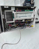 Jandy Aqualink RS pool automation system mounted on exterior equipment wall for pool controller operation
